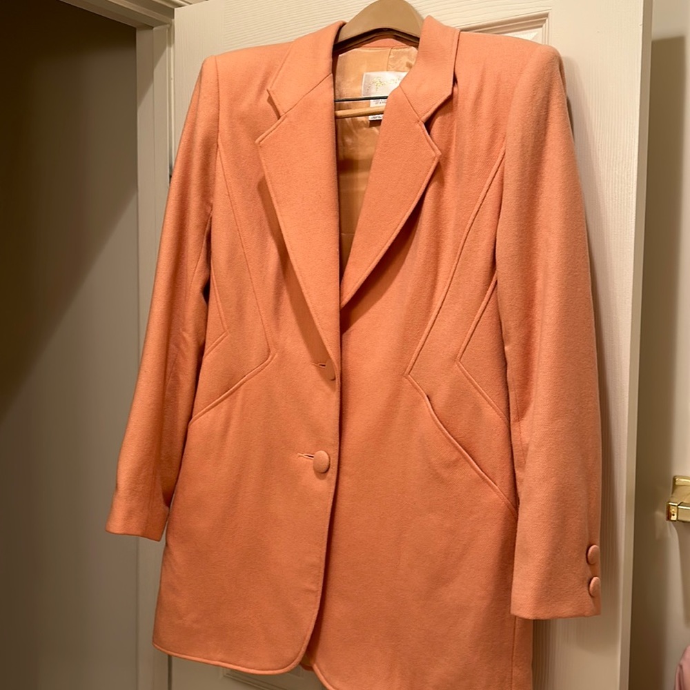Long jacket with buttons in front and on sleeves